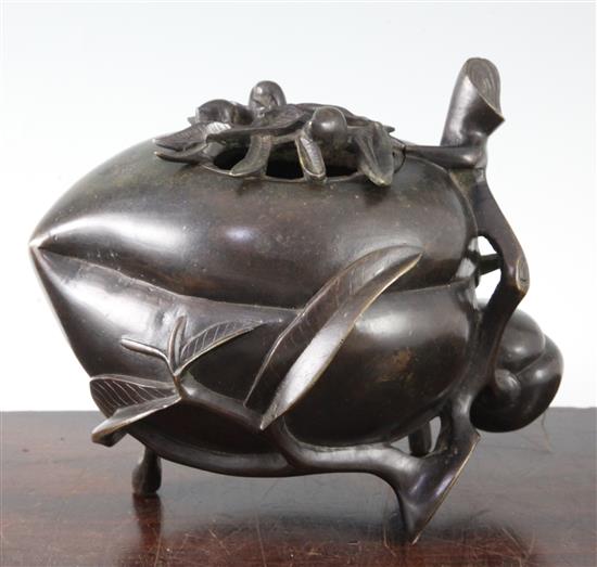 A large Chinese bronze peach-shaped censer and cover, 17th/18th century, height 17.5cm, length 21cm